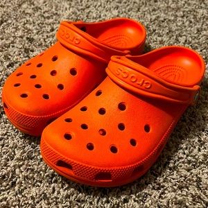 Orange crocs worn one time, cleaning before shipping
